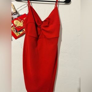 Spaghetti strap red dress. Slight slit at thigh.